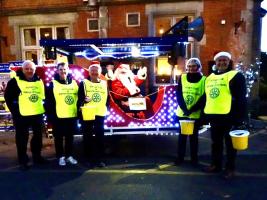 Santa and the elves ready to greet the children